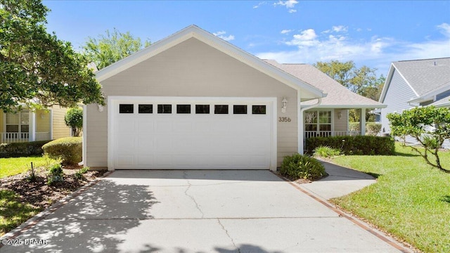 3356 Newbliss Cir, Ormond Beach, FL 32174 - view of front of house with a front yard, a garage, and driveway