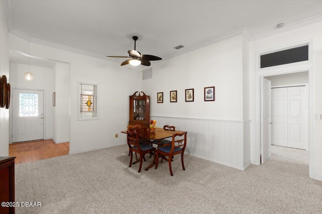 3356 Newbliss Cir, Ormond Beach, FL 32174 - carpeted dining area featuring a ceiling fan, visible vents, and ornamental molding