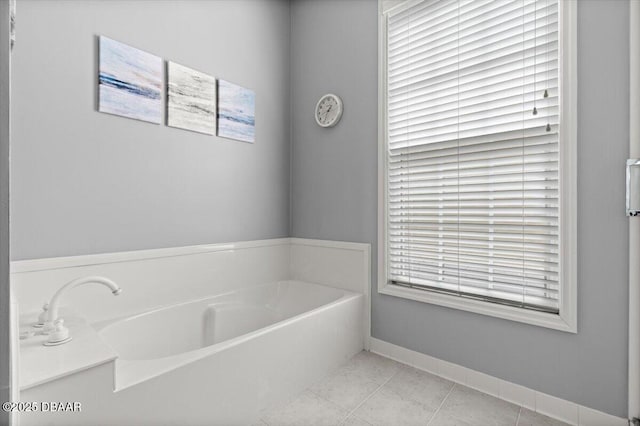 3356 Newbliss Cir, Ormond Beach, FL 32174 - full bathroom featuring tile patterned floors, baseboards, and a garden tub