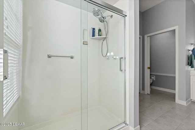 3356 Newbliss Cir, Ormond Beach, FL 32174 - full bathroom with tile patterned floors, baseboards, toilet, and a shower stall