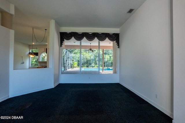 carpeted empty room with a wealth of natural light