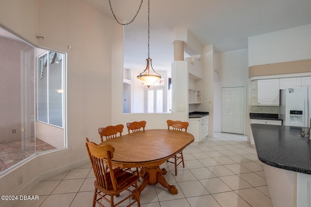 tiled dining area with a healthy amount of sunlight