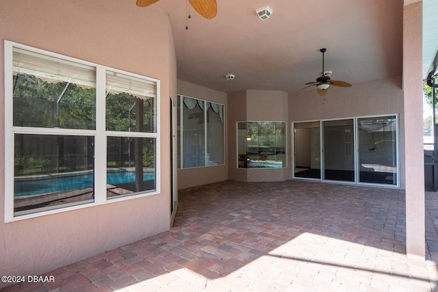 view of patio featuring ceiling fan