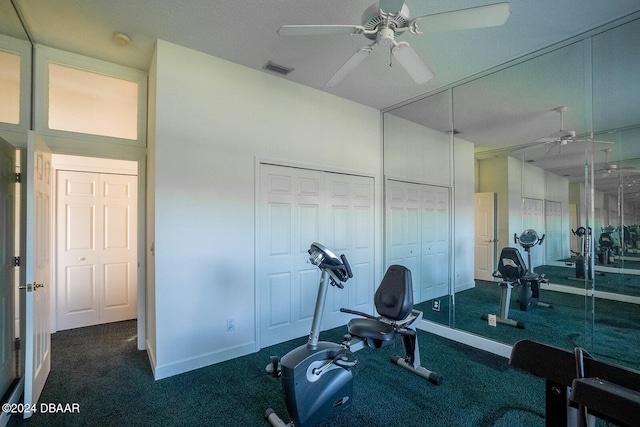 exercise room with ceiling fan