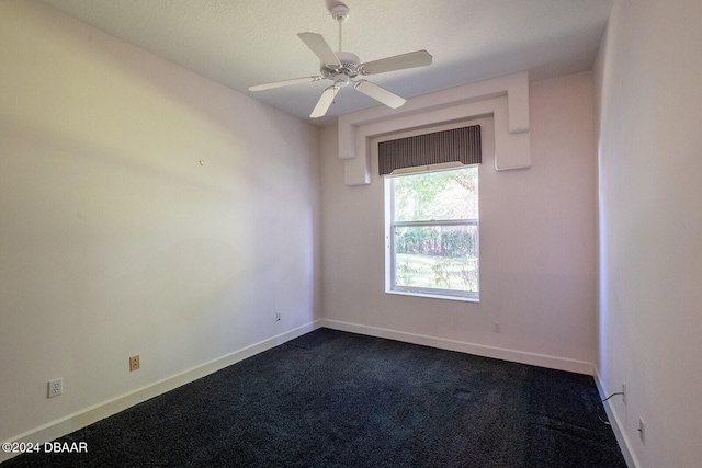 carpeted empty room with a textured ceiling and ceiling fan