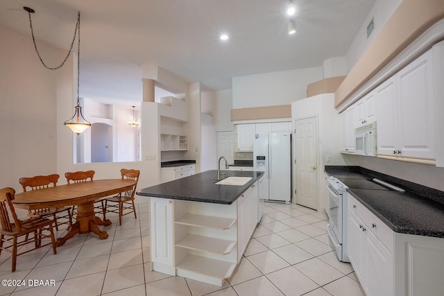 kitchen featuring white cabinets, white appliances, a center island with sink, and light tile patterned floors