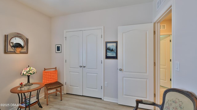 551 Armoyan Way, New Smyrna Beach, FL 32168 - living area with light wood-style flooring and baseboards