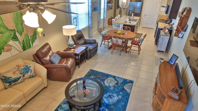 551 Armoyan Way, New Smyrna Beach, FL 32168 - living area with a ceiling fan and light tile patterned flooring