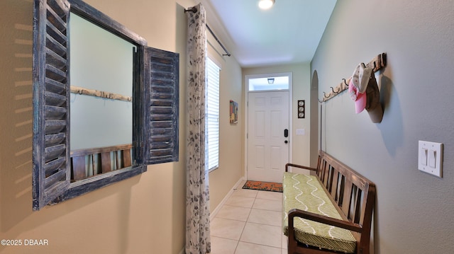 551 Armoyan Way, New Smyrna Beach, FL 32168 - entryway featuring tile patterned flooring and baseboards