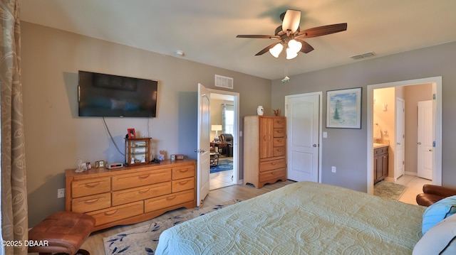 551 Armoyan Way, New Smyrna Beach, FL 32168 - bedroom featuring connected bathroom and ceiling fan