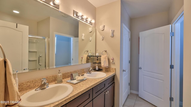 551 Armoyan Way, New Smyrna Beach, FL 32168 - bathroom featuring double vanity, tile patterned flooring, and a shower stall