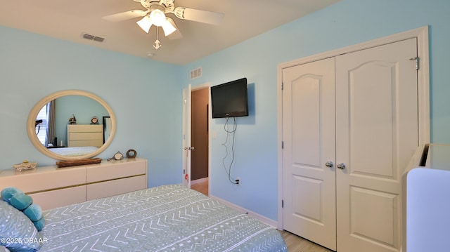 551 Armoyan Way, New Smyrna Beach, FL 32168 - bedroom featuring a closet, a ceiling fan, and light wood-style floors