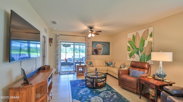 551 Armoyan Way, New Smyrna Beach, FL 32168 - living area with ceiling fan and light tile patterned floors