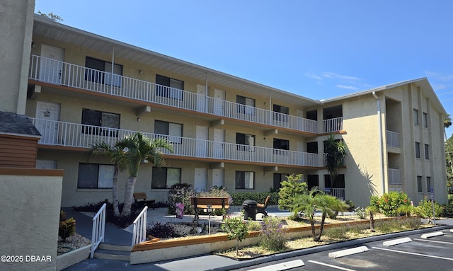 view of property with uncovered parking