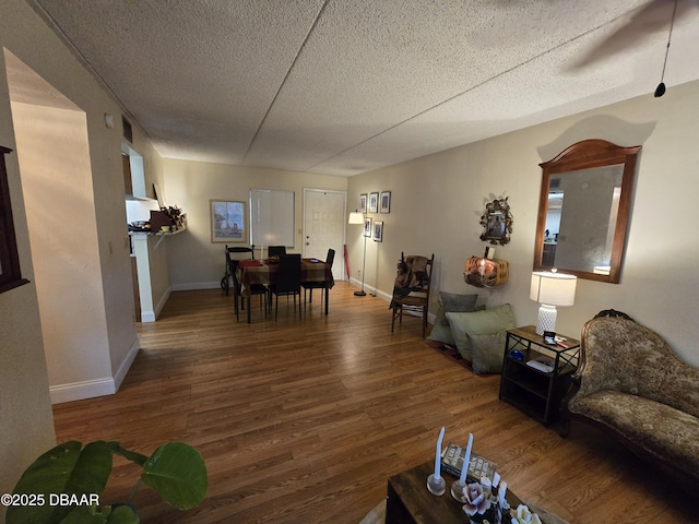 633 S Palmetto Ave Unit 202, Daytona Beach, FL 32114 - living room with baseboards, a textured ceiling, and wood finished floors
