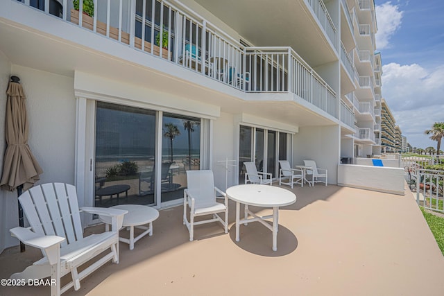 4641 S Atlantic Ave Unit 107, Ponce Inlet, FL 32127 - view of patio featuring a balcony