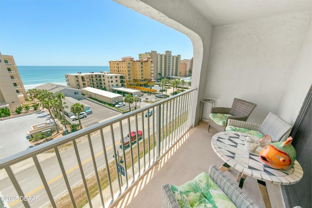 balcony featuring a water view