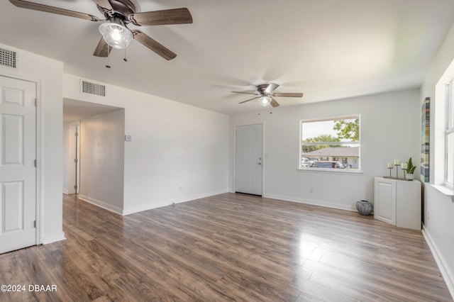 unfurnished room featuring ceiling fan and dark hardwood / wood-style flooring