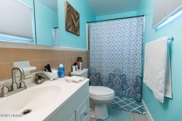 full bath with tile walls, toilet, vanity, a shower with curtain, and tile patterned floors