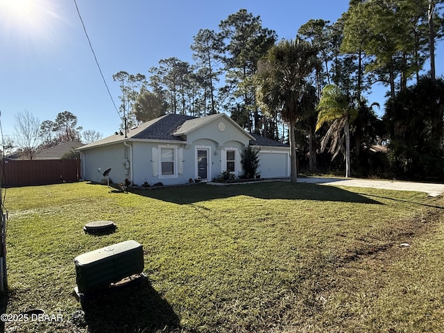 single story home with a garage and a front yard