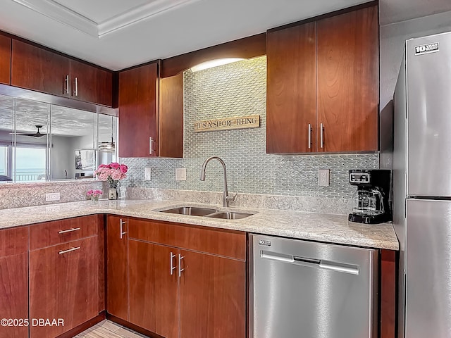 3333 S Atlantic Ave Unit 605, Daytona Beach, FL 32118 - kitchen featuring appliances with stainless steel finishes, a sink, backsplash, and light stone counters