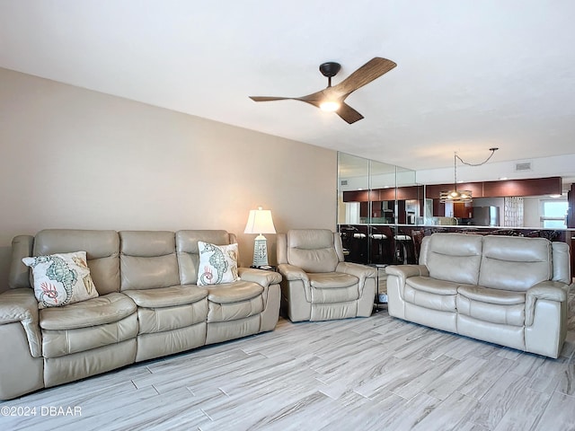 3333 S Atlantic Ave Unit 605, Daytona Beach, FL 32118 - living area with a ceiling fan and wood finished floors