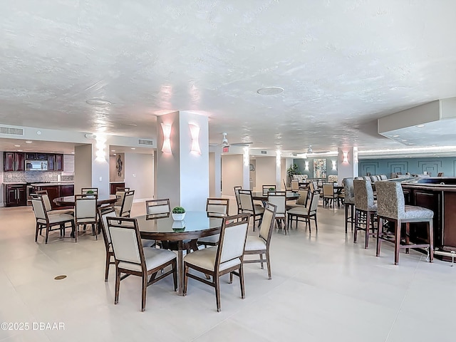 3333 S Atlantic Ave Unit 605, Daytona Beach, FL 32118 - dining area with a textured ceiling