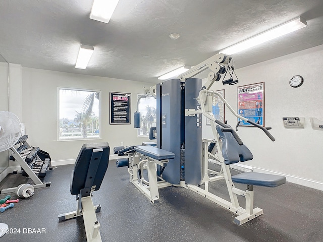 gym with a textured ceiling