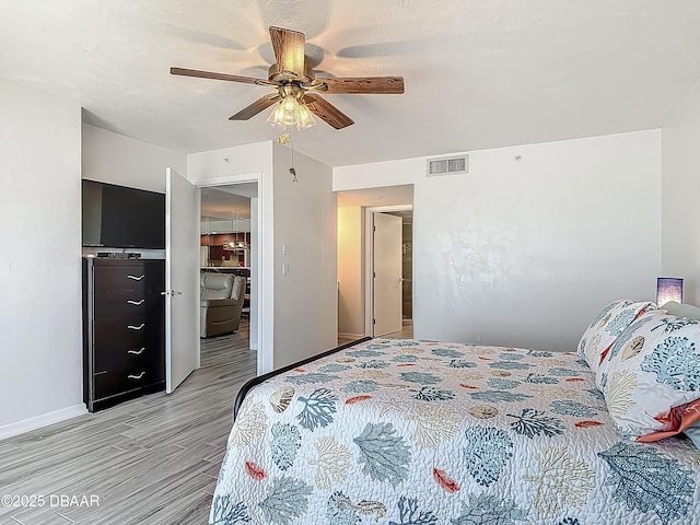 3333 S Atlantic Ave Unit 605, Daytona Beach, FL 32118 - bedroom featuring light wood-style flooring, baseboards, and ceiling fan