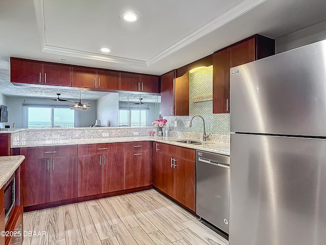 3333 S Atlantic Ave Unit 605, Daytona Beach, FL 32118 - kitchen featuring appliances with stainless steel finishes, a sink, light stone countertops, decorative backsplash, and recessed lighting