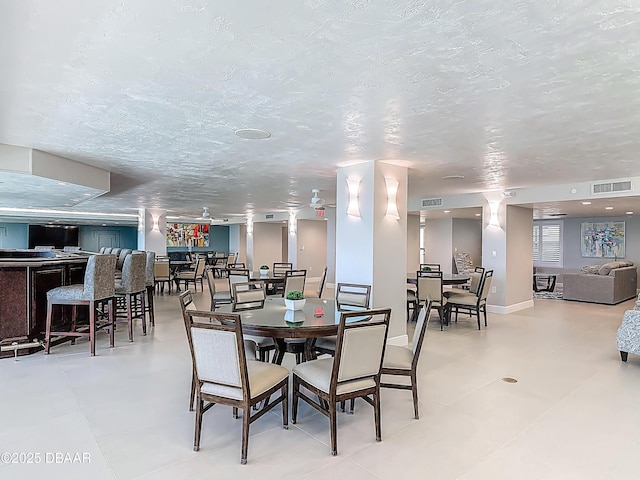 3333 S Atlantic Ave Unit 605, Daytona Beach, FL 32118 - dining space with a textured ceiling