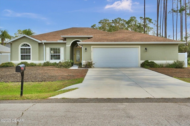 25 Egret Trl, Palm Coast, FL 32164 - ranch-style house featuring a garage, stucco siding, driveway, and roof with shingles
