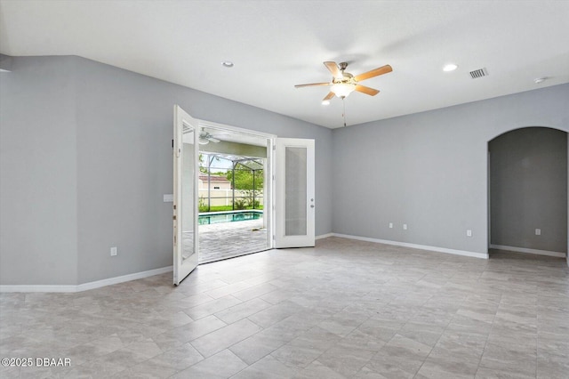25 Egret Trl, Palm Coast, FL 32164 - empty room with arched walkways, ceiling fan, and recessed lighting