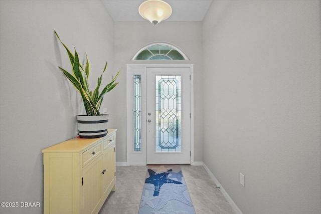 25 Egret Trl, Palm Coast, FL 32164 - foyer entrance with light tile patterned flooring and baseboards