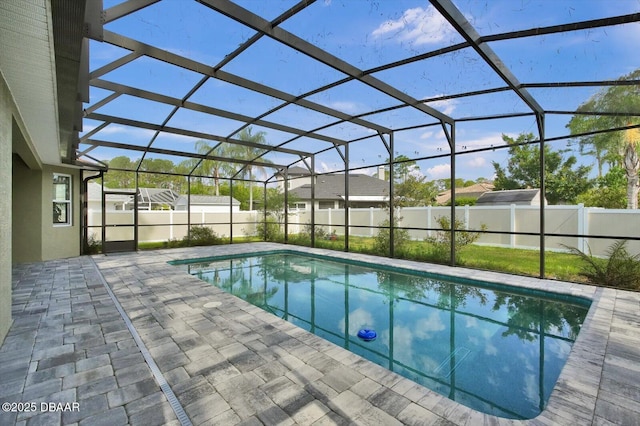 25 Egret Trl, Palm Coast, FL 32164 - view of swimming pool featuring a patio area, a fenced backyard, and glass enclosure