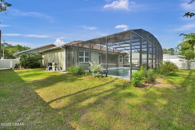 25 Egret Trl, Palm Coast, FL 32164 - back of house featuring a fenced backyard, an outdoor pool, and stucco siding