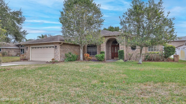 view of front facade with a front lawn and a garage