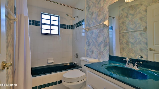 full bathroom with toilet, vanity, and shower / bath combination with curtain