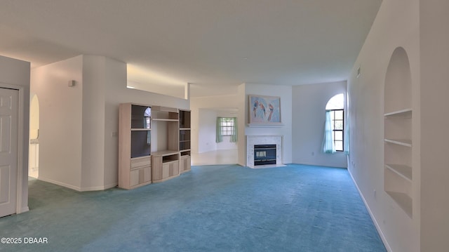 unfurnished living room featuring carpet flooring