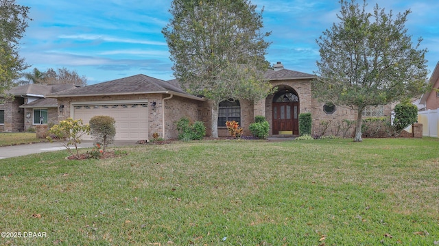 single story home with a front yard and a garage