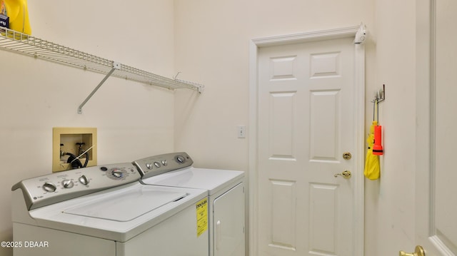 laundry room with washing machine and dryer