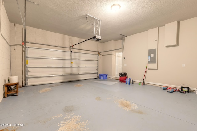 garage featuring electric panel and a garage door opener