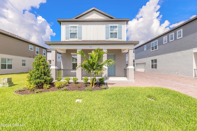 view of front of property with cooling unit and a front yard