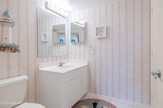 bathroom with vanity and toilet