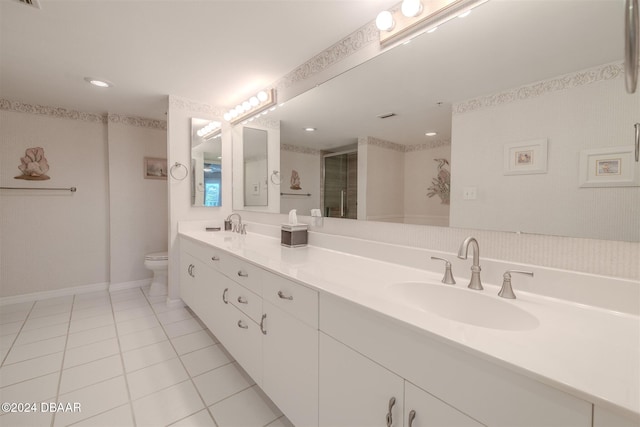 bathroom featuring tile patterned floors, vanity, an enclosed shower, and toilet