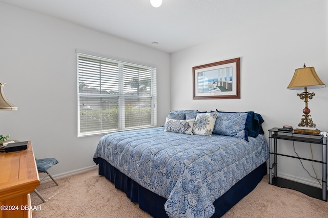 bedroom featuring light colored carpet