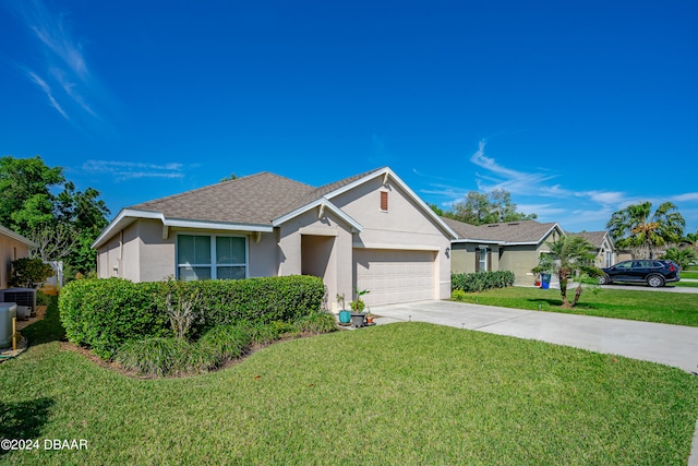 single story home featuring central AC unit, a front yard, and a garage