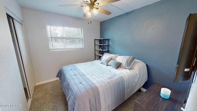 bedroom with baseboards, speckled floor, and ceiling fan