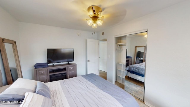 bedroom with a closet and visible vents