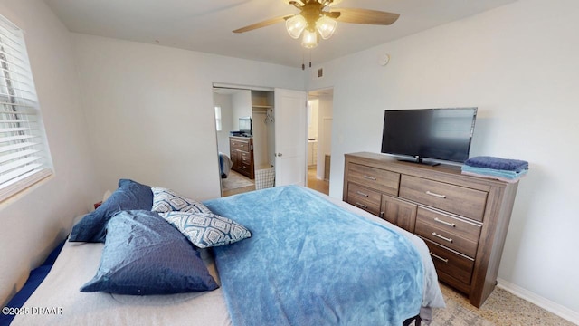 bedroom with baseboards and ceiling fan